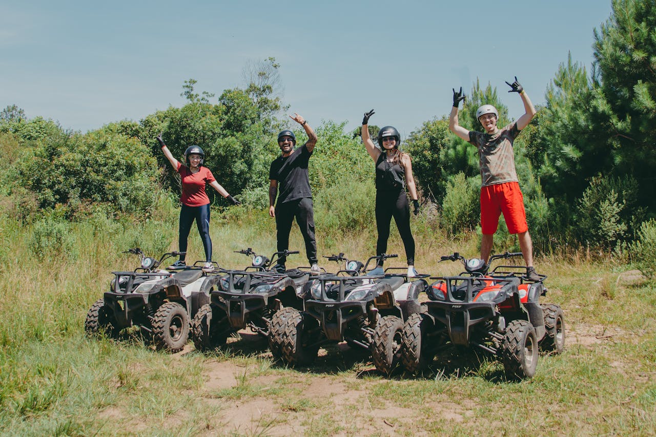 gallery-5 Four people enjoying a thrilling ATV ride in Quatro Barras, Brazil.